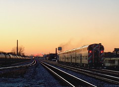 Westbound Metra commuter local heading in to a winter sunset. Chicago Illinois. December 2006.