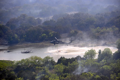 Blackhawk hovers over a water source