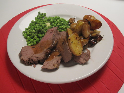 Moose roast, roasted potatoes and pears with garlic and thyme, peas