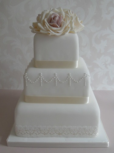 Lace wedding cake with sugar flowers