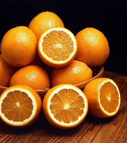 Oranges, some sliced in half
