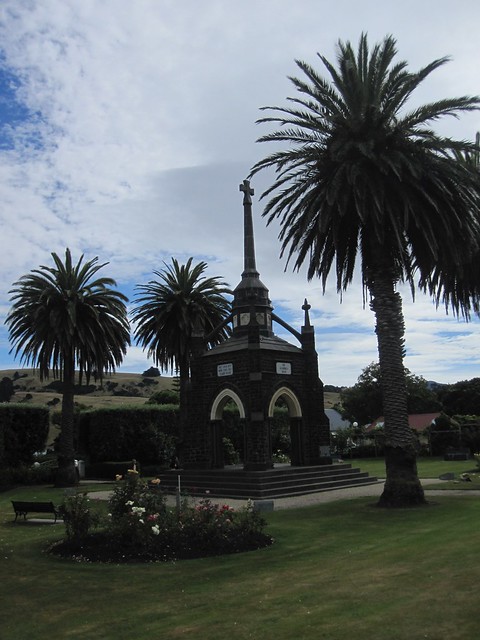 Akaroa 6 - European looking monument flanked by palm trees by Ben Beiske