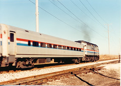 Eastbound speeding Amtrak train. Summit Illinois. December 1990.