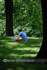 Young Man with Laptop in the Park by astrycula