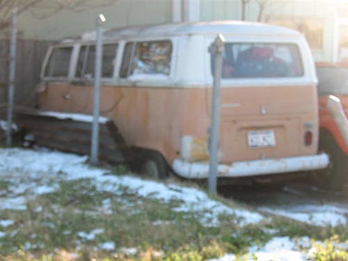 Orange and White Bay Window VW Bus in North Richland Hills Texas Driver