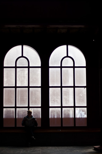 A man reading in the train station.