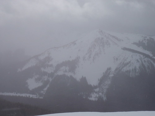 An un-named peak appears out of the clouds in the Silver Cr. Drainage.