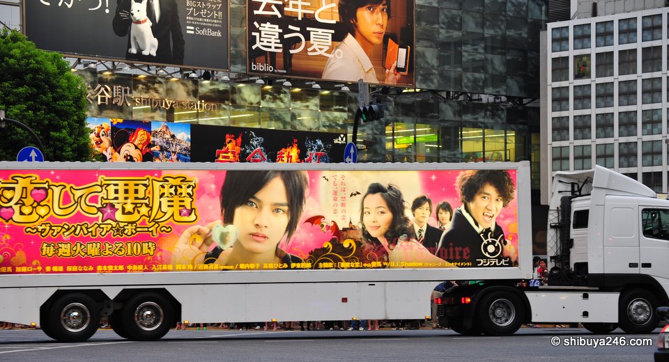 Large truck ads for new TV show on Fuji Television roar by