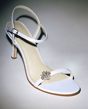 Shoe design married with a beautiful brooch. 