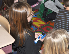 A second-grader at Valley View Elementary School in Portland, CT uses a clicker to answer questions posed at the end of a language arts video lesson about "cause and effect."