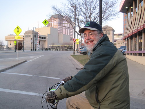 Dad biking in the city.