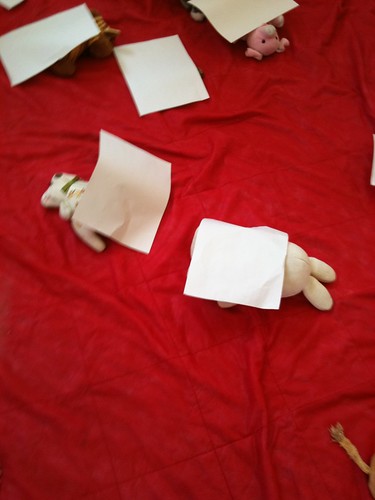 Teddy bears under paper