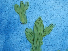 painted and stitched cacti