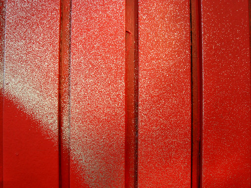 Silver Spraypaint and Shadows on Red