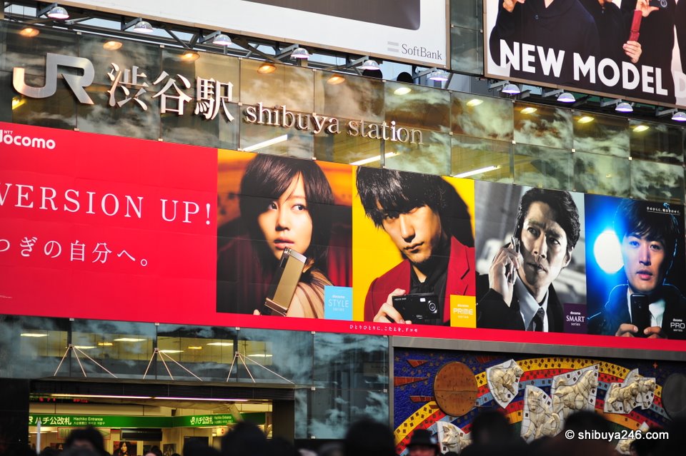 NTT DoCoMo working its ads on Shibuya Station building. Who is your favorite from this set of 4?