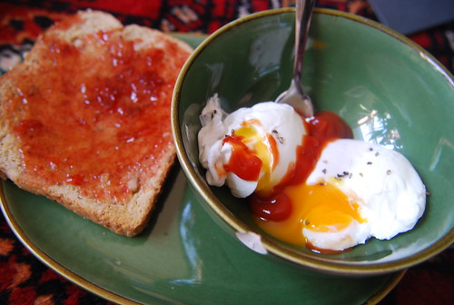Poached egss and toast with strawberry jam