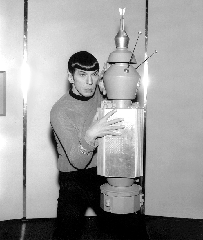 Leonard Nimoy cops a feel from an unsuspecting N.O.M.A.D. during an NBC press junket.