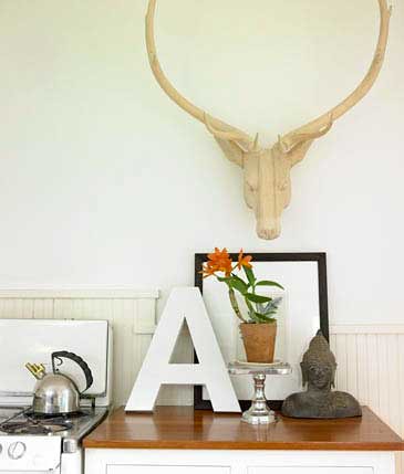White kitchen: Artful display + wooden deer head