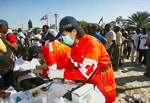 A medical aid worker from the People's Republic of China performing duties in a camp in the Caribbean nation of Haiti. The nation was struck by a 7.0 earthquake on January 12, 2010. by Pan-African News Wire File Photos