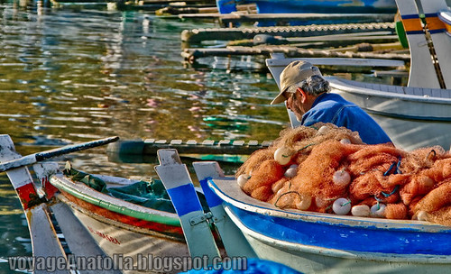 Fisherman at Amasra Wharf by voyageAnatolia