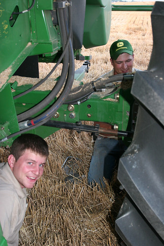 Two John Deere Reps work on fixing Callums GPS.