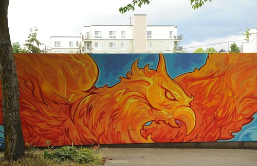 From the ashes arises the Phoenix, mural covering the location of the arson which burned out an old building with several businesses, Greenwood, Seattle, Washington, USA by Wonderlane