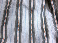 White and orange striped men's shirting