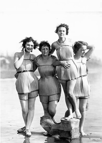 "Spruce Girls" on beach wearing spruce wood veneer bathing suits during "Wood Week" to promote products of the Gray Harbor lumber industry, Hoquiam, Washington