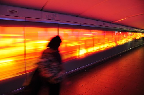 Glowing orange/gold walkway under Railway Square, Sydney - slow exposure