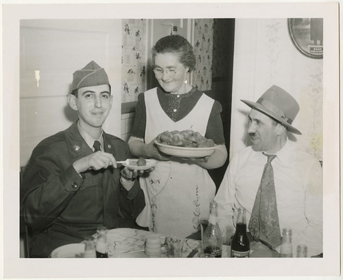 Pfc. Morton Gutstadt tried out the gefilte fish of Mrs. Dave Starr..., 1952
