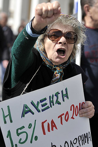 Woman protests austerity cuts in Greece