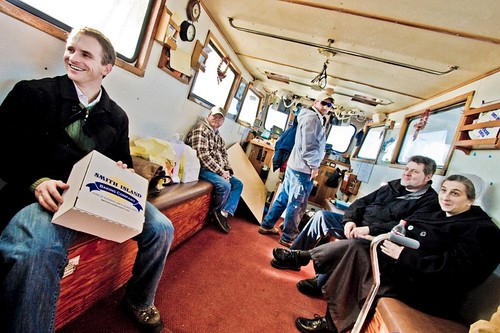 Murphy chats with his fellow passengers aboard the Island Belle. 