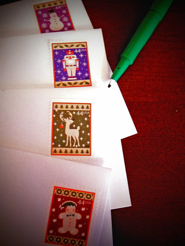 Stamping and addressing Christmas cards