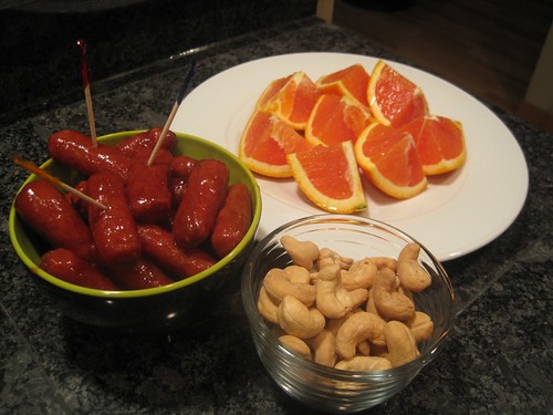 Cara Cara orange, cashews, and little BBQ weenies