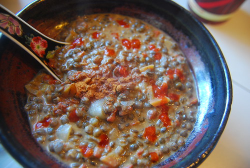 Lentil stew with goat yogurt, cinnamon and dots of Rooster Sauce