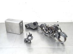 4 Piece Metal Sculpture; A dog, a Harley, a trailer, and a fuel tank