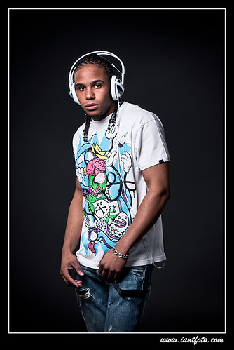 Young African-American man listening music.
