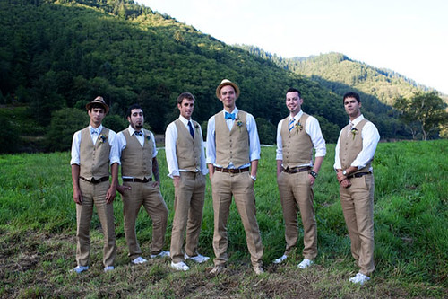 From the tan vests and pants down to the blue bow ties and hand positions 