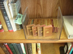 If you need something unique, look no further than our glass cases. They hold  collectible books, like these vintage miniature Shakespeare plays.
