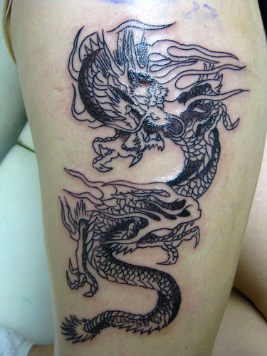 dragon tattoo thigh. japanese dragon tattoo