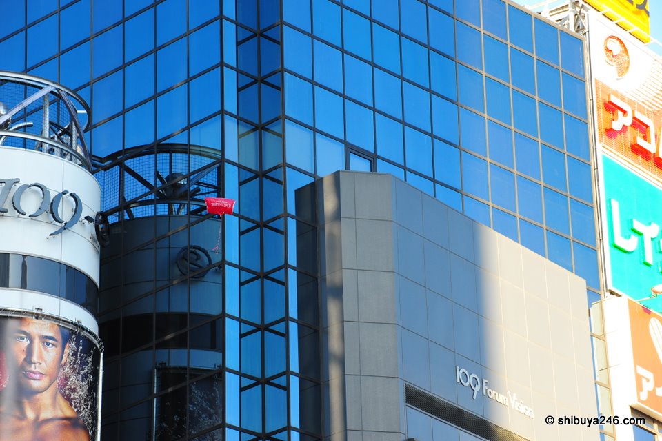One of the balloons scales the 109 building.