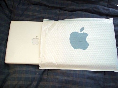 Apple laptop next to bubble sleeve