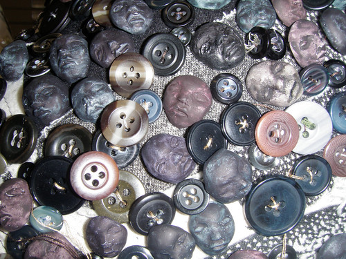 buttons (close up of dirty feet)