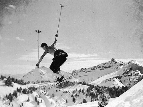 Skier making a cornice jump near Edith Creek, Mount Rainier