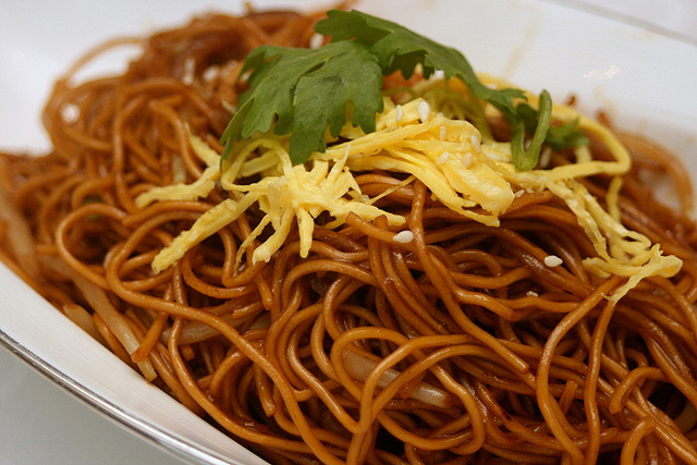 Wok-fried egg noodles with shredded chicken in superior soy sauce