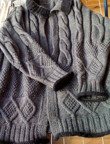 Grey Aran cardigan with moss stitch and cables