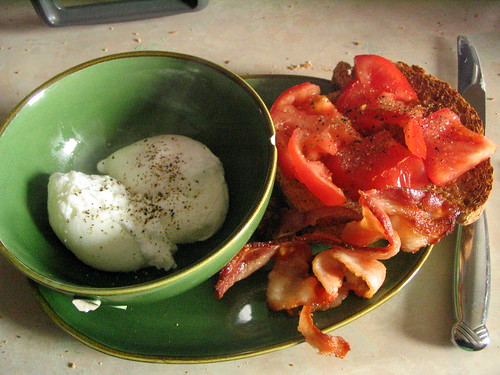 Poached eggs, toast with tomato and bacon