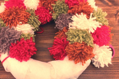 that yarn pom pom wreath is almost finished