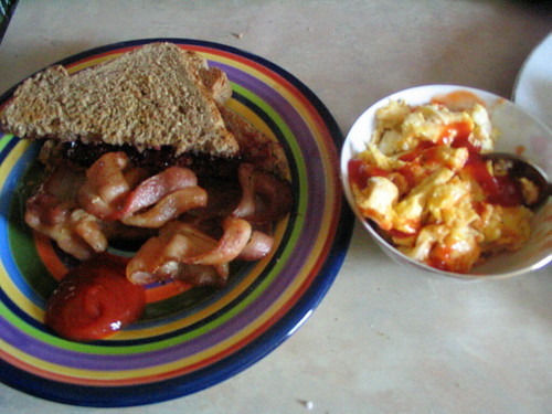 Scrambled eggs, toast and bacon