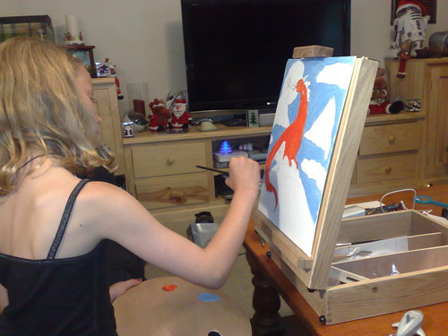 Caitlin painting a dragon